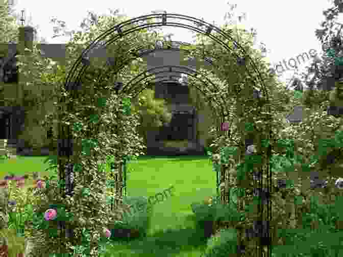 A Garden With A Winding Path Leading To A Rose Arch Alan Titchmarsh How To Garden: Garden Design