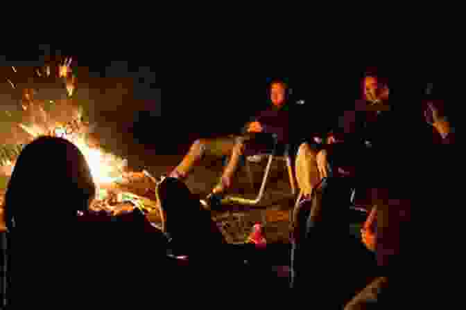 A Group Of People Sit Around A Campfire Under The Stars Wandering Joy Nicolas Diat