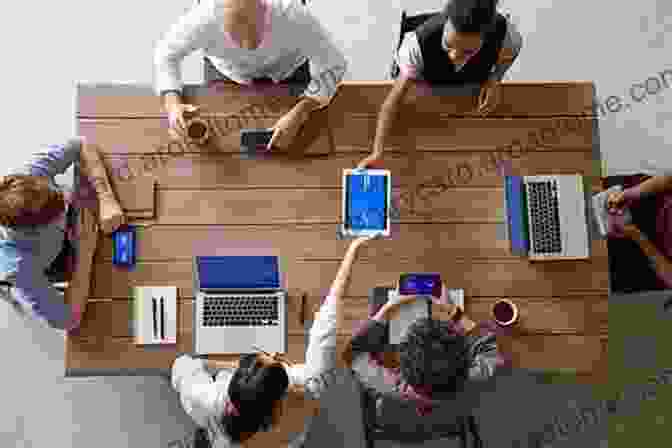 A Group Of People Sitting Around A Table, Discussing Media Business. Media Production: A Practical Guide To Radio TV And Film