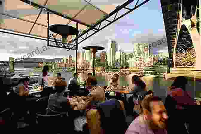 Family Enjoying A Meal At A Waterfront Restaurant On Granville Island Granville Island ABC: A Family Adventure