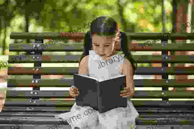 Little Girl Sits On A Bench, Reading A Book About Paris, Her Expression Filled With Wonder. Poppy Takes Paris: A Little Girl S Adventures In The City Of Light (Big City Adventures)